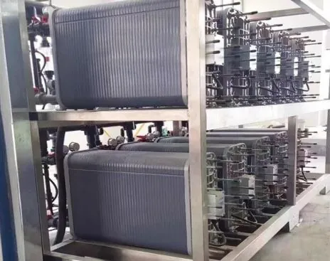 Plate-style water treatment modules with process pipework and a supporting frame